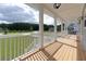 Spacious porch featuring wood floors, white railings, and views of the community at 1329 Wood Sorrel Dr, Moncks Corner, SC 29461