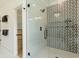 Modern shower with glass doors and decorative tile at 1329 Wood Sorrel Dr, Moncks Corner, SC 29461