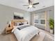 Cozy bedroom with a ceiling fan and a natural light from windows at 139 Gazania Way, Charleston, SC 29414