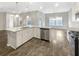 Open-concept kitchen featuring granite countertops, stainless steel appliances, and an island at 139 Gazania Way, Charleston, SC 29414