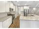 Kitchen with stainless steel appliances, granite countertops, and white cabinets at 139 Gazania Way, Charleston, SC 29414