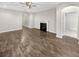 Living room with fireplace, hard wood floors and archways to other rooms at 139 Gazania Way, Charleston, SC 29414