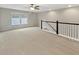 Loft space with railing, ceiling fan, and window views at 139 Gazania Way, Charleston, SC 29414