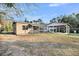 Spacious backyard with covered patio area, perfect for outdoor entertaining and relaxation at 1393 Secessionville Rd, James Island, SC 29412