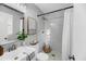Bright bathroom featuring shower with white tiles and marble mosaic floor at 1393 Secessionville Rd, James Island, SC 29412