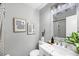 Modern bathroom featuring vanity, framed art, and shower with stylish curtain at 1393 Secessionville Rd, James Island, SC 29412