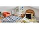 Stylish bedroom featuring a cozy chair and a view from the window at 1393 Secessionville Rd, James Island, SC 29412