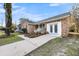 Lovely brick home featuring a walkway that leads to a white door with glass panes at 1393 Secessionville Rd, James Island, SC 29412