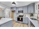 Updated kitchen features modern stainless steel appliances, light grey cabinets and stylish hardware at 1393 Secessionville Rd, James Island, SC 29412
