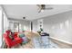 Bright living room featuring a modern desk, ceiling fan, and lots of natural light at 1393 Secessionville Rd, James Island, SC 29412