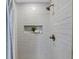 Shower stall with white subway tiles and mosaic shower caddy at 1393 Secessionville Rd, James Island, SC 29412