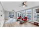 Sun-filled room featuring large windows and ceiling fans at 1393 Secessionville Rd, James Island, SC 29412