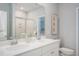Modern bathroom featuring double sinks, a large mirror, and a walk-in shower, offering style and convenience at 141 Threaded Fern St, Summerville, SC 29485
