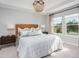 Stylish bedroom with a large bed, decorative lighting, and ample natural light for a comfortable and inviting space at 141 Threaded Fern St, Summerville, SC 29485