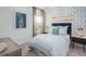 Cozy bedroom featuring nautical themed decor, soft lighting, and a view out the window at 141 Threaded Fern St, Summerville, SC 29485