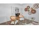 Bright home office space featuring a glass desk, modern decor, and a view into the living area at 141 Threaded Fern St, Summerville, SC 29485