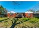 Spacious backyard with a well-maintained lawn and charming back porch at 1423 Fairfield Ave, Charleston, SC 29407
