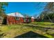 Lush backyard with a spacious lawn and patio, great for outdoor activities at 1423 Fairfield Ave, Charleston, SC 29407