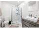 The bathroom features a glass shower, gray vanity, and white tile walls at 1423 Fairfield Ave, Charleston, SC 29407