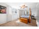 A large bedroom offers natural light, a ceiling fan, and a four poster bed at 1423 Fairfield Ave, Charleston, SC 29407