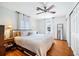 A bright bedroom features a ceiling fan, hardwood floors, and neutral decor at 1423 Fairfield Ave, Charleston, SC 29407