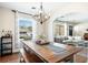 Dining room with a large wooden table, bench seating, and a view into the living room at 1423 Fairfield Ave, Charleston, SC 29407