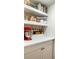 This kitchen features a white countertop, cabinets, shelving, and a red stand mixer at 1423 Fairfield Ave, Charleston, SC 29407