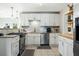 Modern kitchen featuring granite countertops, stainless steel appliances, and bright white cabinetry at 1423 Fairfield Ave, Charleston, SC 29407