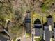 Aerial view of the property showcasing its layout, surrounding trees, and spacious backyard at 144 St Phillips Row, Summerville, SC 29485