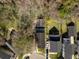 Aerial view of the property showcasing its layout, surrounding trees, and spacious backyard at 144 St Phillips Row, Summerville, SC 29485