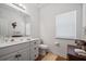 Bathroom features a double sink vanity, wood floors and lots of natural light at 144 St Phillips Row, Summerville, SC 29485