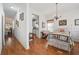 Bright bedroom featuring hardwood floors, chandelier, and access to a modern kitchen at 144 St Phillips Row, Summerville, SC 29485