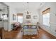 This bedroom is bright with hardwood floors, wainscoting, and an iron bed at 144 St Phillips Row, Summerville, SC 29485