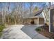 Attached carport area with ample parking space and access to the house and backyard at 144 St Phillips Row, Summerville, SC 29485