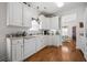 Well-lit kitchen with white cabinetry, modern appliances, and access to the bedroom at 144 St Phillips Row, Summerville, SC 29485
