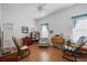 Inviting living room with wood floors and cozy seating area with a ceiling fan at 144 St Phillips Row, Summerville, SC 29485