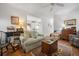 Inviting living room features wood floors, classic furniture, and access to a bright kitchen at 144 St Phillips Row, Summerville, SC 29485