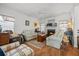 A classic living room features a fireplace, ceiling fan, and comfortable seating arrangement at 144 St Phillips Row, Summerville, SC 29485