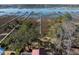 Aerial view showcases the property's waterfront location with long docks extending into the serene water at 1464 Dupree Creek Rd, Awendaw, SC 29429