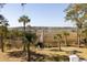 Enjoy this marsh view with private dock surrounded by palm trees at 1464 Dupree Creek Rd, Awendaw, SC 29429