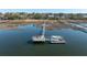 Scenic waterfront view featuring a private dock with boat, surrounded by natural marshland and waterway access at 1464 Dupree Creek Rd, Awendaw, SC 29429