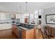 Open kitchen design with stainless steel appliances, granite countertops, and breakfast bar at 1464 Dupree Creek Rd, Awendaw, SC 29429