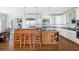 Spacious kitchen features granite countertops, stainless steel appliances, and wood floors at 1464 Dupree Creek Rd, Awendaw, SC 29429