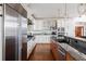 Gourmet kitchen boasts stainless steel appliances, granite countertops, and custom cabinetry at 1464 Dupree Creek Rd, Awendaw, SC 29429