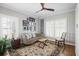 Sitting room featuring a zebra-print couch, wooden floors, and a patterned area rug at 1464 Dupree Creek Rd, Awendaw, SC 29429