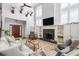 Spacious living room with a fireplace, built-in shelves, and high ceilings for a grand and inviting space at 1464 Dupree Creek Rd, Awendaw, SC 29429
