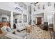 Spacious living room with high ceilings, beautiful decor, and an open layout connecting to the kitchen at 1464 Dupree Creek Rd, Awendaw, SC 29429