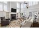 Bright living room with a soaring ceiling, fireplace, built-in shelves, and plenty of natural light at 1464 Dupree Creek Rd, Awendaw, SC 29429