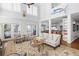 Bright and airy living room featuring high ceilings, an open layout, and seamless transition to the gourmet kitchen at 1464 Dupree Creek Rd, Awendaw, SC 29429