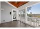 Inviting screened-in porch features wood ceiling and views of lush outdoor scenery at 1464 Dupree Creek Rd, Awendaw, SC 29429